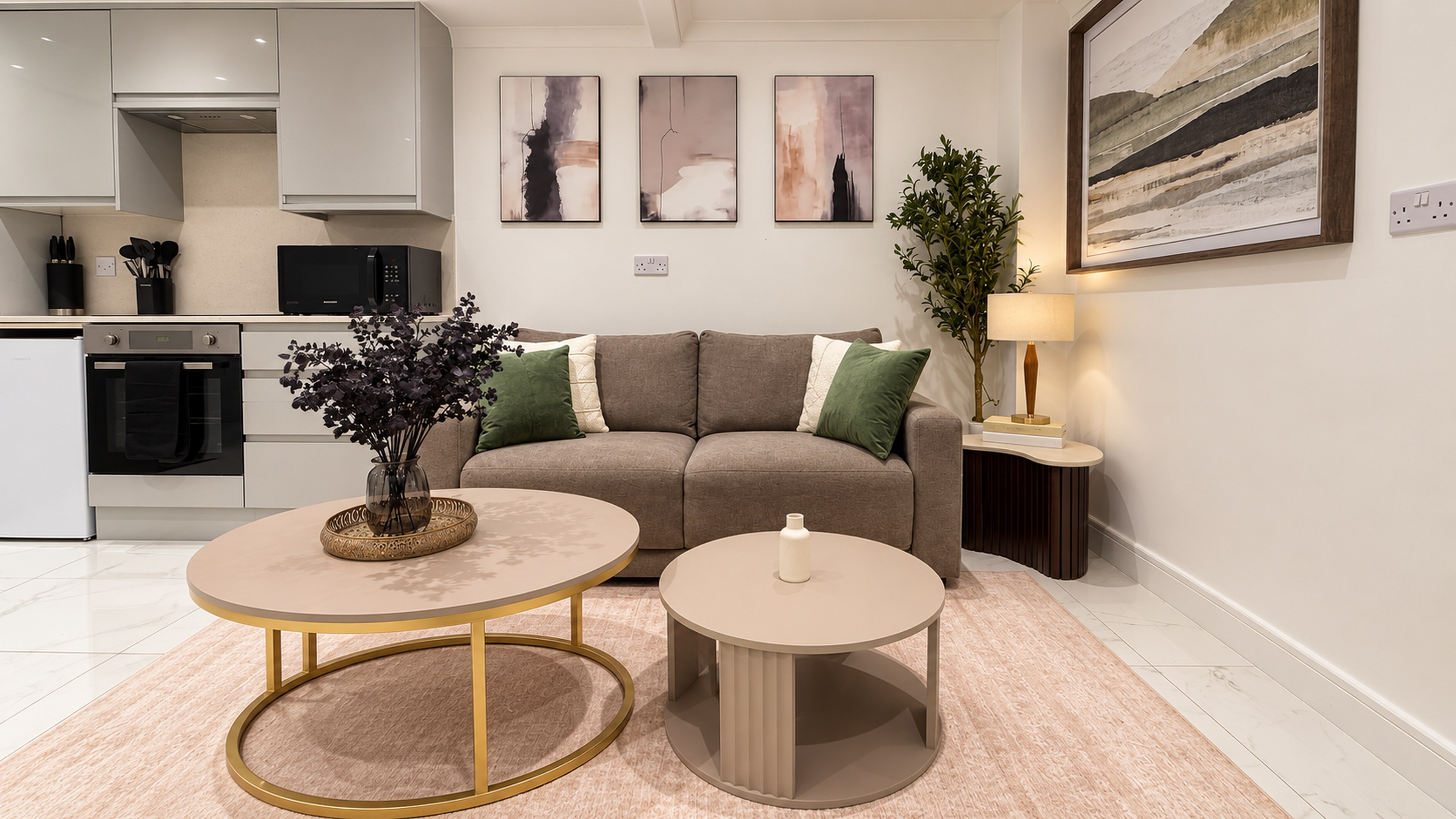 Living area with sofa and private kitchen — ExecStay basement apartment