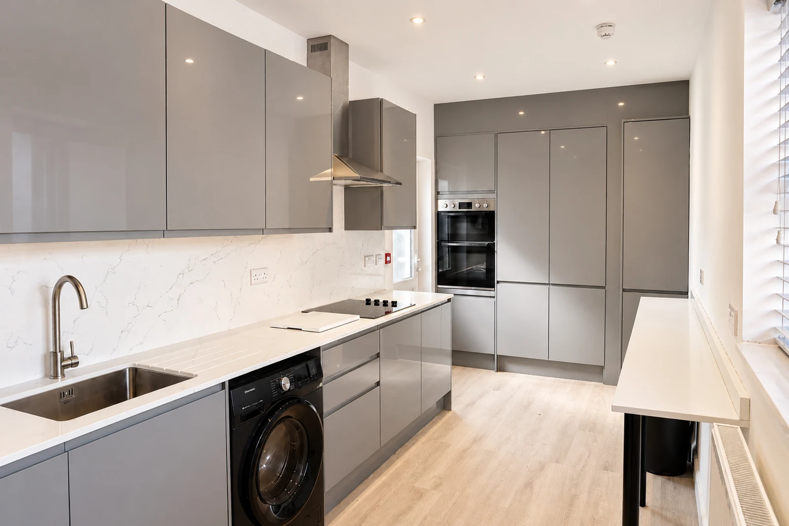 The shared kitchen for Rooms 1–5 has an oven, hob, fridge and space to prepare meals. The basement apartment has its own separate kitchen.