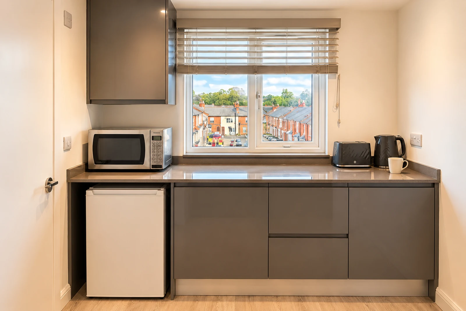 Room 5’s private kitchenette includes a fridge, microwave, kettle and toaster. The full shared kitchen is also available.
